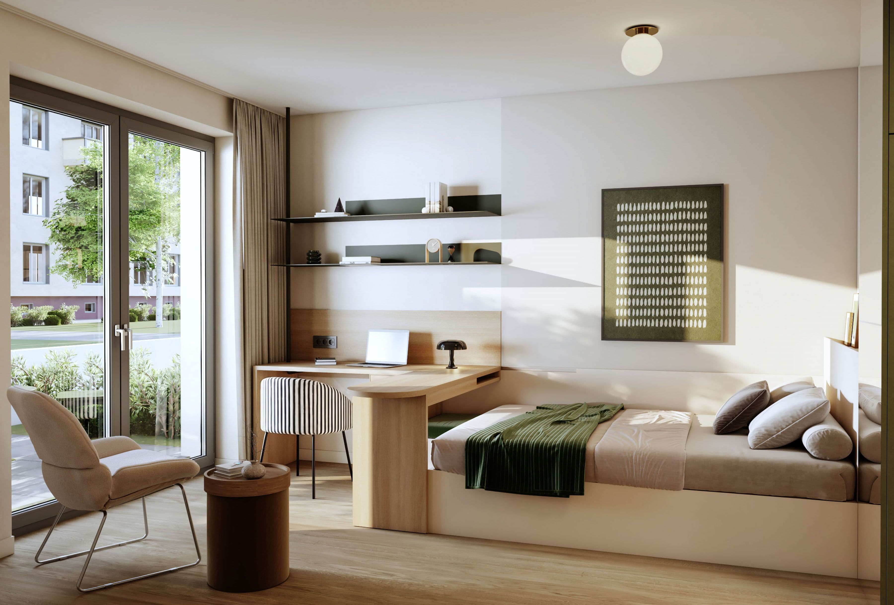 Wohn- und Schlafbereich eines FRIEDRICH-Apartments: Schreibtisch mit Regalwand geht in ein Bett mit Kissen über, links ein Sessel an der bodentiefen Balkontür mit Blick ins Grüne.